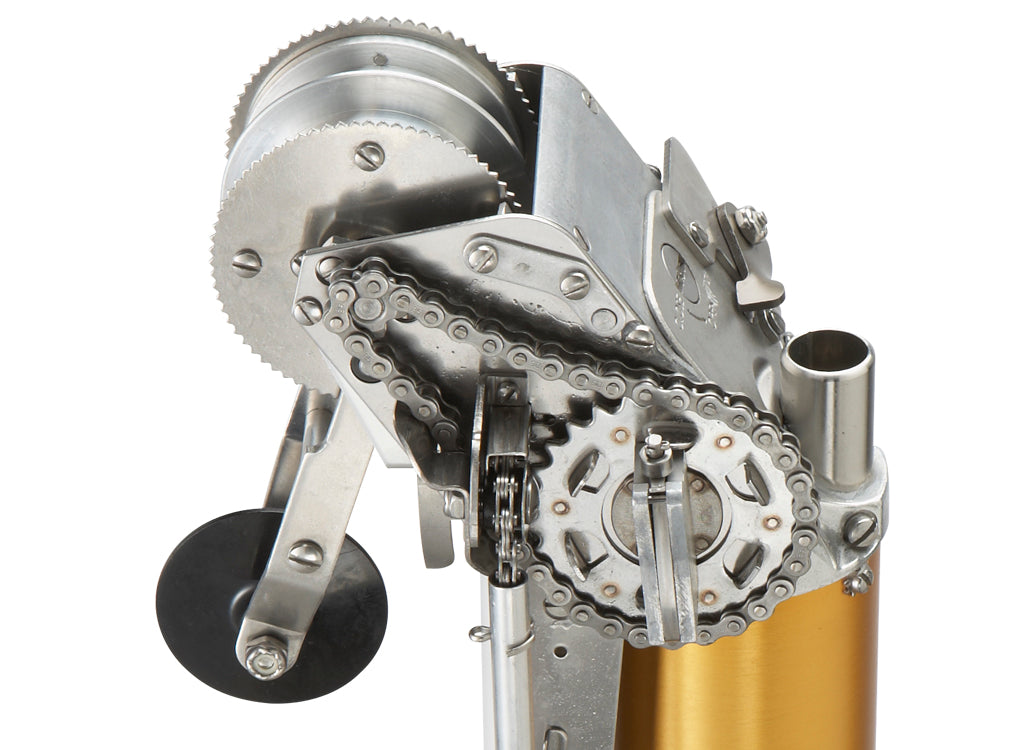 Close-up of TapeTech 03TT Mini EasyClean Automatic Taper head with gold body, stainless steel cutting blade, and black creaser wheel, right side