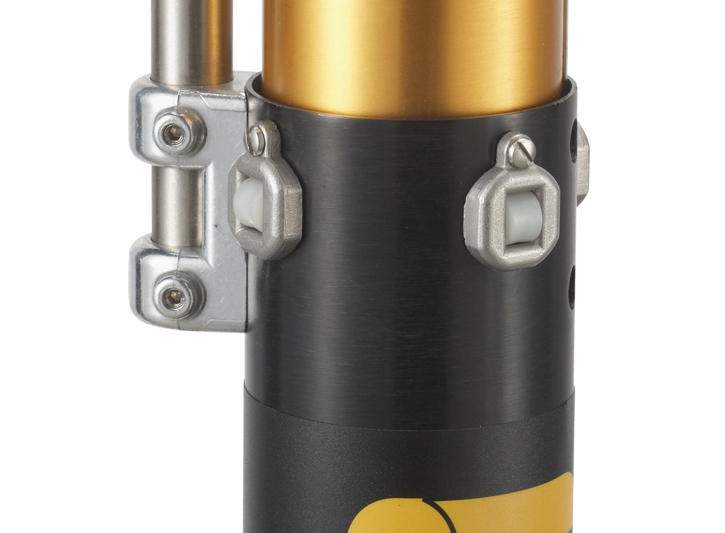 Close-up of the TapeTech 03TT Mini EasyClean Automatic Taper, gold body, black control tube, and white enclosed rollers