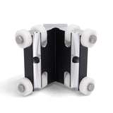 90-degree Columbia External Applicator made from billet aluminum with a black finish and 8 white plastic wheels, front view